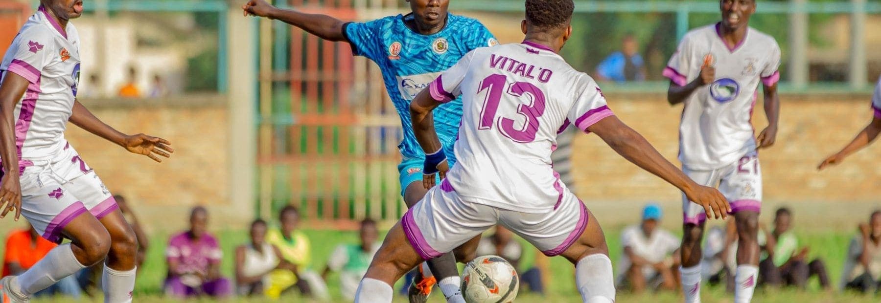 Players challenging for the ball during a tournament match